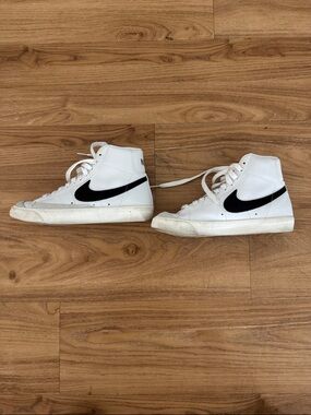 Nike White High-Top Sneakers with Black Swoosh Accents